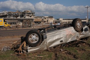Demolished autos and extensive damage to the Moore Medical Building show the affect of the EF-5 tornado which hit this area on May 20. George Armstrong/FEMA 