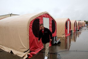 Winterized tents are being constructed in the responder camp to provide housing to those volunteers who will be providing recovery support to the disaster survivors that were affected by severe flooding. The responder camp is constructed by The State of Alaska and designed to provide housing and general everyday services to the recovery workers while they rebuild the homes and businesses that were affected. Adam DuBrowa/ FEMA 