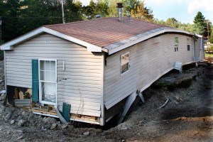 This trailer home was ripped off its foundation and broken in half by tropical storm Irene's flooding. The storm left acres of silt and debris as a result of the state wide flooding. Photo by Angela Drexel/FEMA