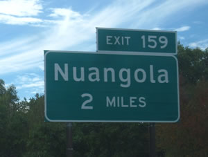 ACCEPTABLE: Example of appropriate use of Clearview for destination legend (mixed-case) and FHWA Standard Alphabets for other legends (all upper-case and numerals). Photo: DOT/FHA