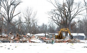 Piles of debris are removed in a neighborhood impacted by the November 17, 2013 tornado. Jocelyn Augustino/FEMA - Location: Brookport, Illinois