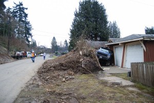 Tech. Sgt. Tayler Bates and Tech Sgt. Tony Rohrenbach, members of the Washington Air National Guard, 141 Civil Engineer Squadron pause for a moment of silence at 10:37 a.m., the same time that the mudslide occurred on Saturday March 22, 2014. Washington National Guard personnel continue to help the community of Oso in the wake of the mudslide. (U.S. Army photo by Staff Sgt. Rory Featherston WA ANG). FEMA news photo