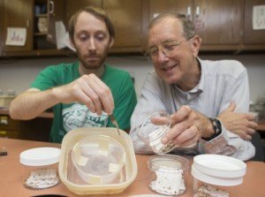 Benjamin Hottel, a University of Florida doctoral student in entomology (left) and Phil Koehler, an urban entomology professor, demonstrate how to build a do-it-yourself bedbug trap. They created a method for building an inexpensive trap to help those who cannot afford professional pest control help.