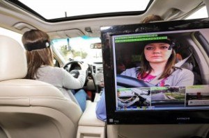 A study participant drives while research equipment monitors reaction times and gathers other data. A set of new University of Utah studies for the AAA Foundation for Traffic Safety found that hands-free, voice-controlled infotainment systems in vehicles can distract drivers more than was previously believed. Photo:  Dan Campbell/AAA 2014.