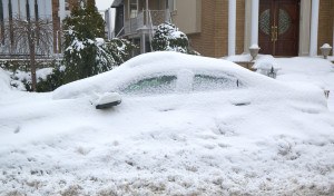 Car completely under snow after massive winter storms strikes No