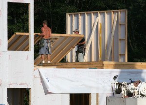 Putting up wall on modular home.