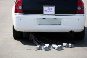 Wedding car with just married sign and cans