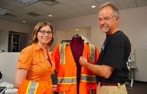 Doctoral student Kristen Hines and Professor Tom Martin of Virginia Tech's College of Engineering discuss the current version of the InZoneAlert safety vest. Image: Virginia Tech
