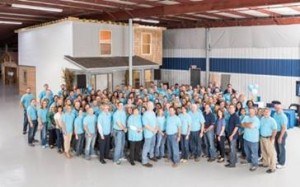 American Modern Insurance employees stand in front of the completed LivingWise home. 