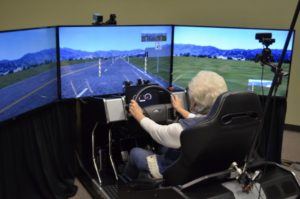 One of the 59 volunteers in a distracted driving study by the University of Houston and Texas A&M Transportation Institute sits in a high-fidelity driving simulator. Photo: Malcolm Dcosta