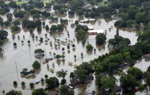 This aerial image shows flooded areas of North Baton Rouge, La., Saturday, Aug. 13, 2016. Louisiana Gov. John Bel Edwards says more than 1,000 people in south Louisiana have been rescued from homes, vehicles and even clinging to trees as a slow-moving storm hammers the state with flooding. (Patrick Dennis/The Advocate via AP)
